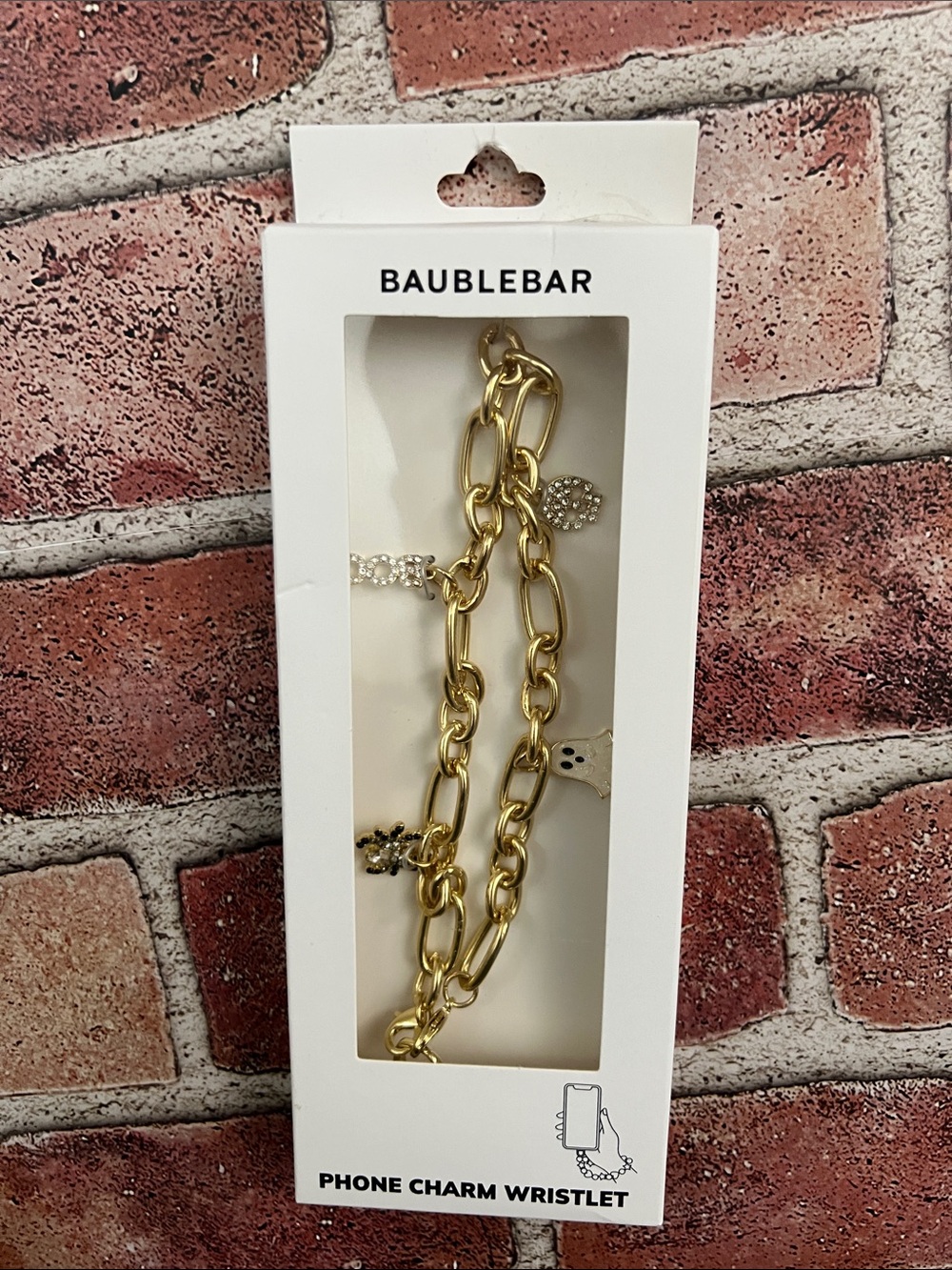 BaubleBar Gold Tone Halloween Charm Phone Wristlet with Rhinestone Accents